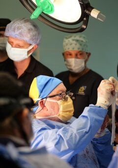 Dr. John Frodel is operating surrounded with Ukrainian colleagues.