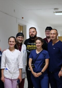 From left to right: Dr. John Frodel, Dr. Augustine Moscatello, Dr. Anna Tovkes, Dr. Ivanka Nebor, Dr. Ryan Winters, Dr. Vitaliy Panchenko, Dr. Volodymyr Salamashchak with the operated patient at the last day of mission.