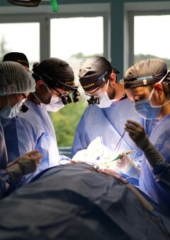 Dr. Parag Gandhi, Dr. Kyrylo Chuhai, Dr. Anna Tovkes, Dr. Olha Chorna are performing operation on the eye.