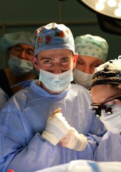 Dr. Ivanka Nebor is teaching Ukrainian resident, Yurij Tsuvanyk (on the left) – assisting as a Surgical tech.